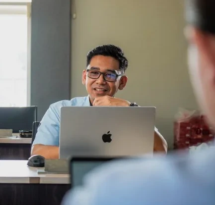 Colleague working at a laptop